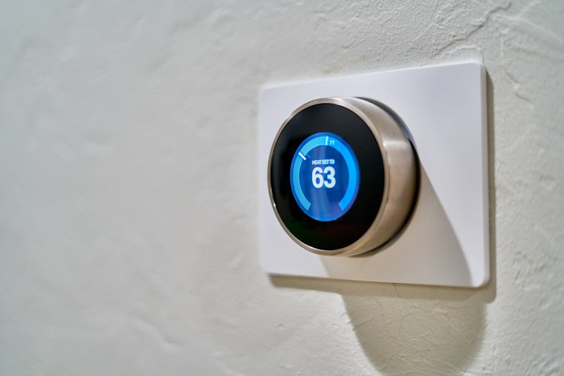 Smart wifi thermostat on wall